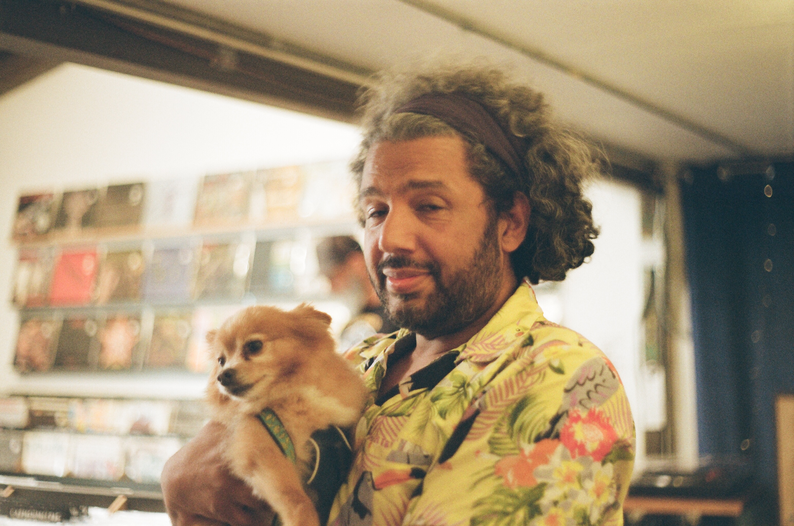 Dom and Leo the dog in a vinyl store in Austin Texas